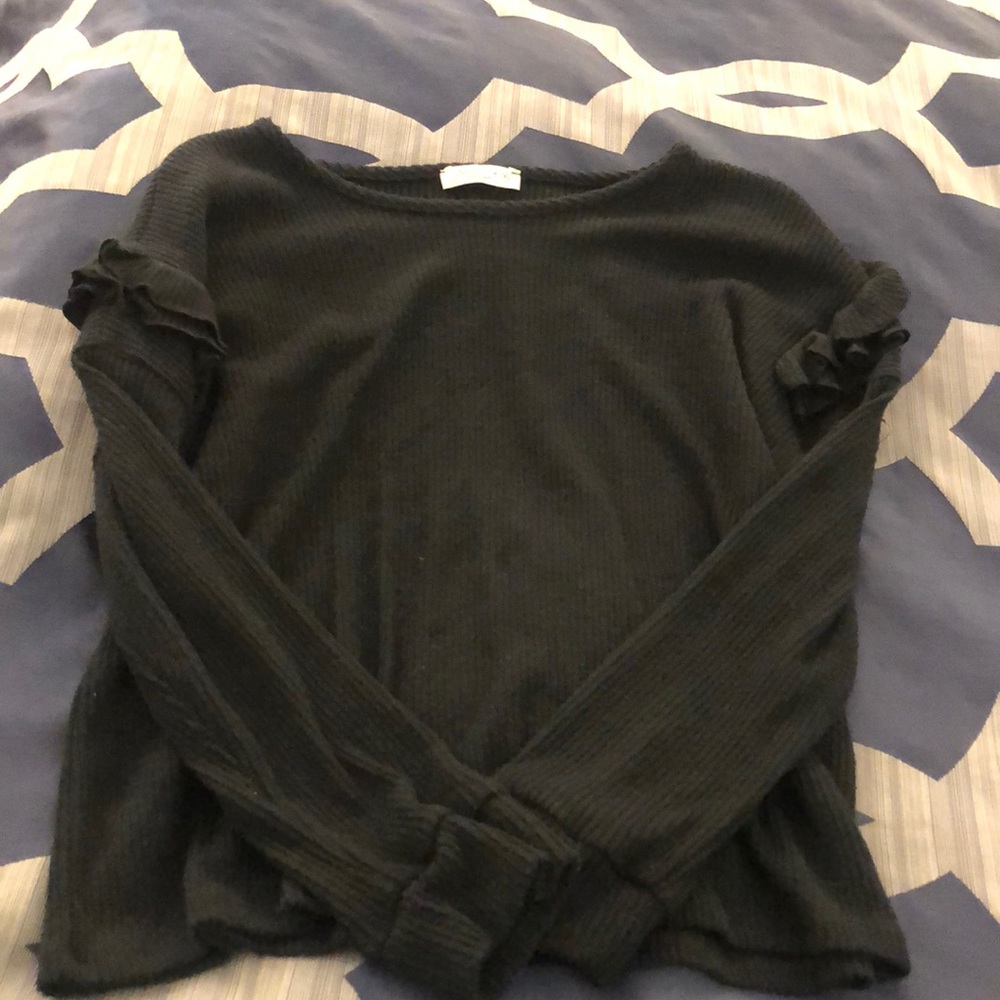 Black sweater with ruffle